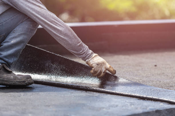 Professional Basement Waterproofing technician working in Farmland, IN